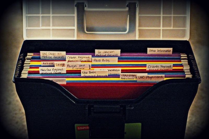 Open file box of labeled hanging folders