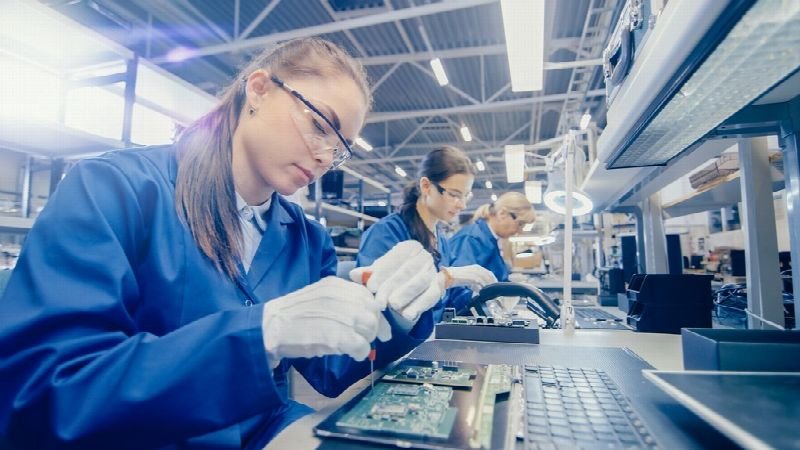 Workers assembling products on a factory line
